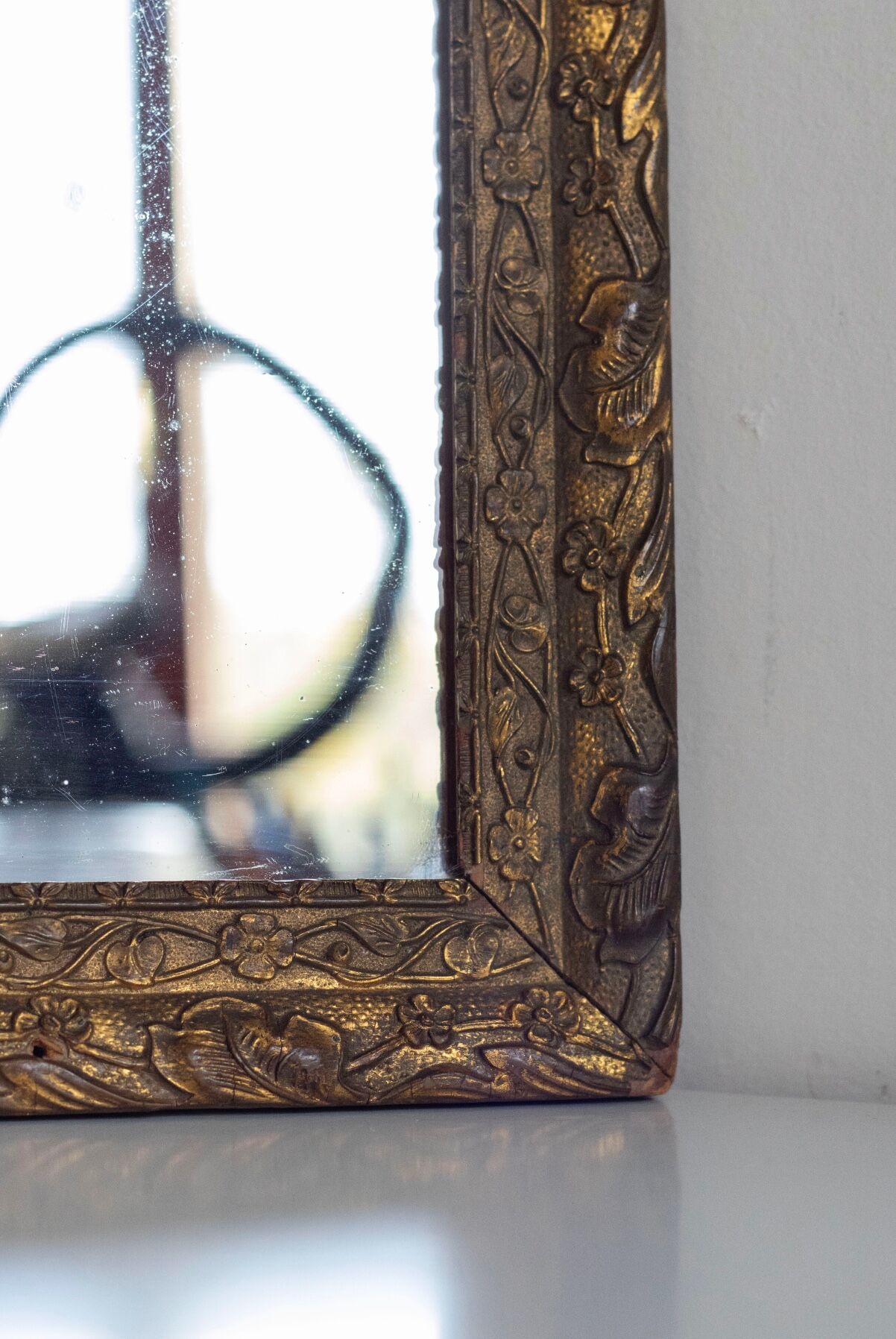 Antique mirror in gilded wood
