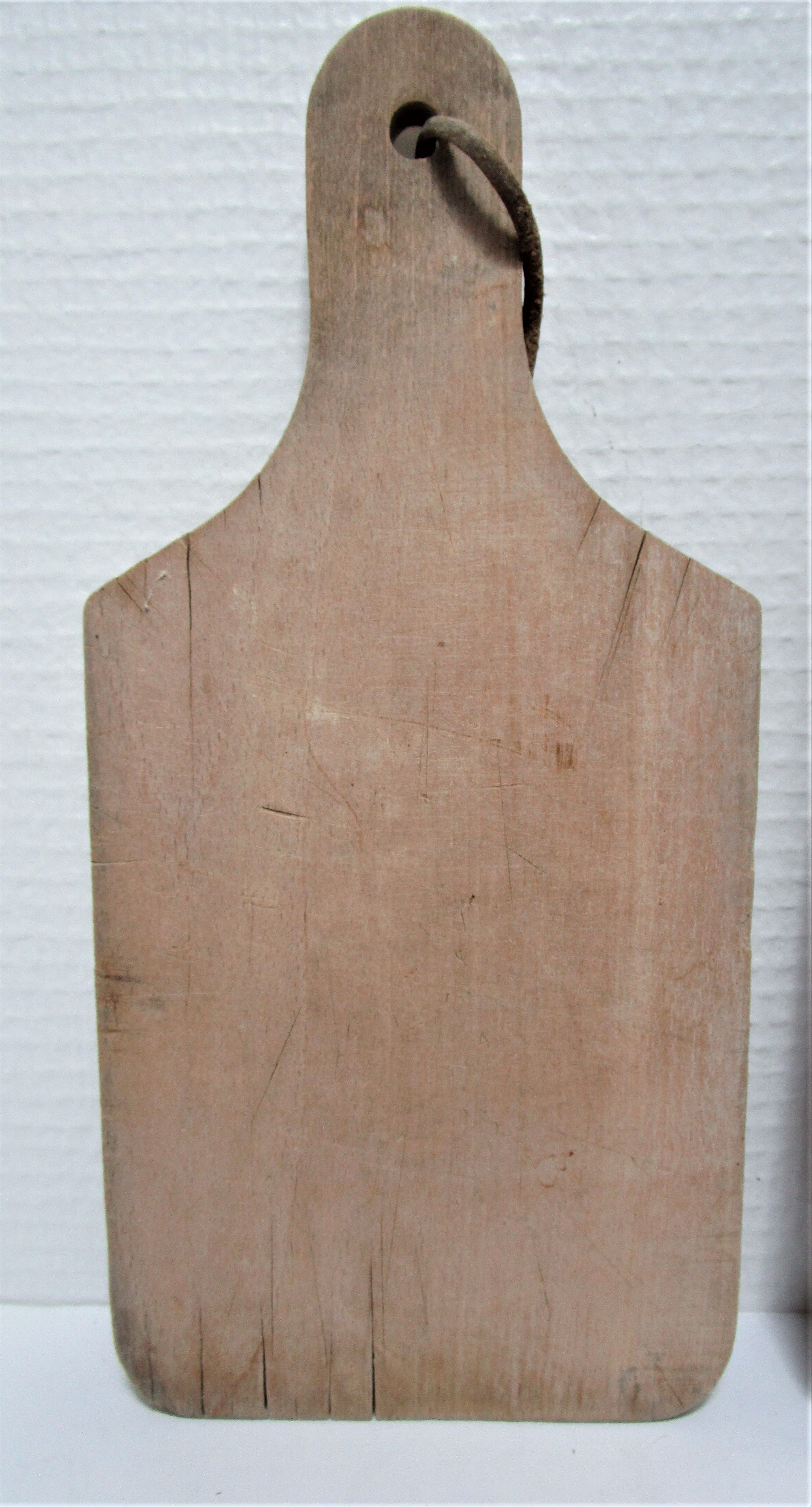 three vintage patinated solid wood cutting boards