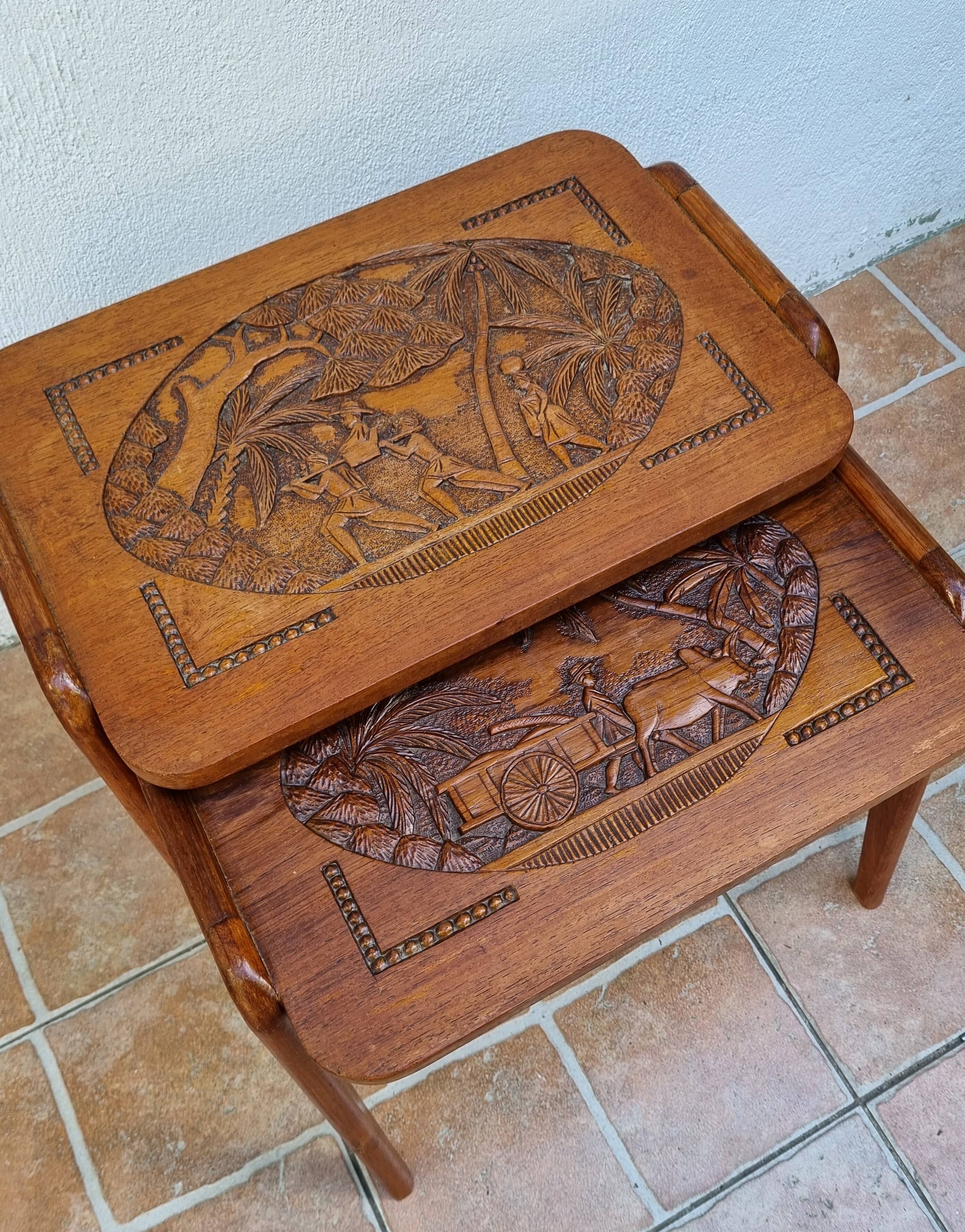 Pair of Malagasy nesting tables in carved wood, signed, m.o.f, 1955