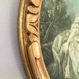 Cadre ovale en bois sculpté doré