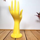 Hand wears ring and yellow soliflore