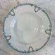Set of 7 deep plates in earthenware, decorated with a green frieze.