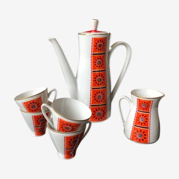 Orange coffee maker and 4 cups and milk jug flower pattern