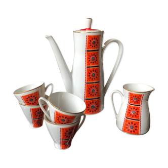 Orange coffee maker and 4 cups and milk jug flower pattern