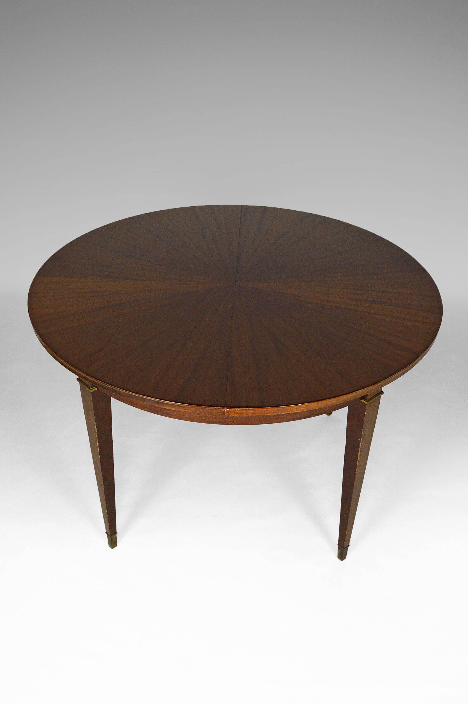 Art Deco mahogany round table by Jacques Adnet around 1940