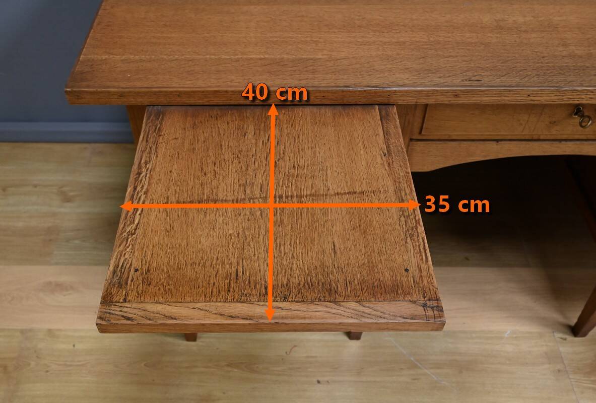 Solid oak pedestal desk, Régy establishments – 1940