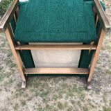Duo of vintage armchairs with green fabrics.