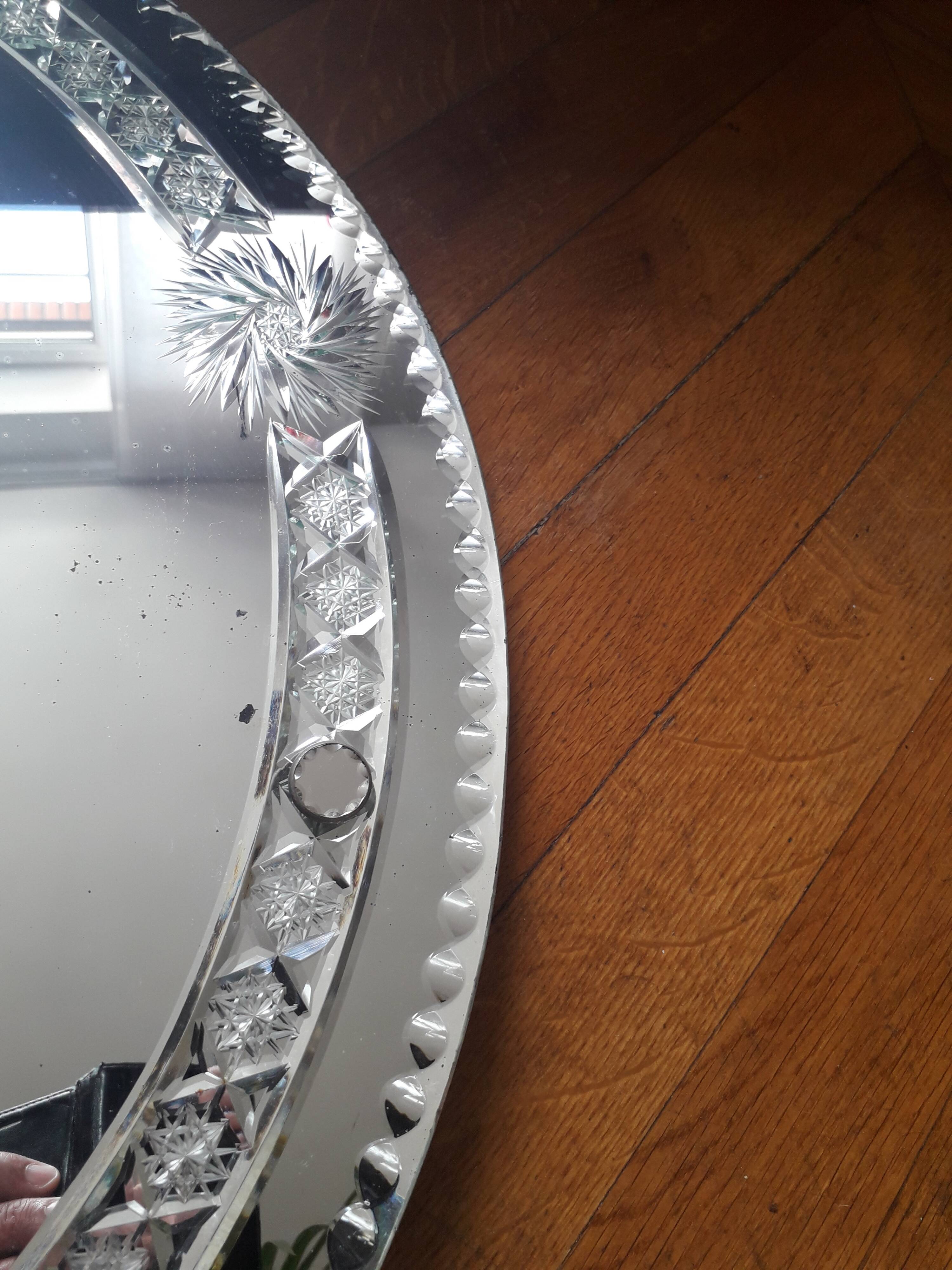 Large old round mirror finely decorated