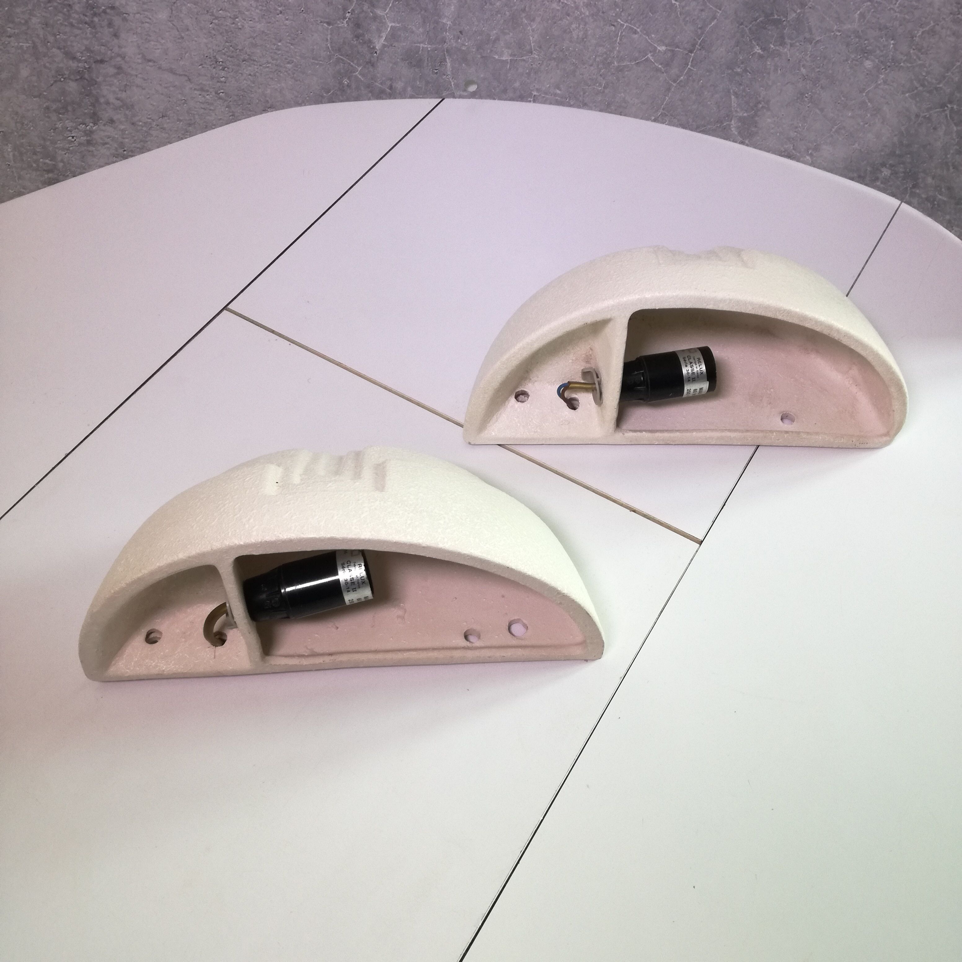 Wall sconces in stone and in the shape of a basin