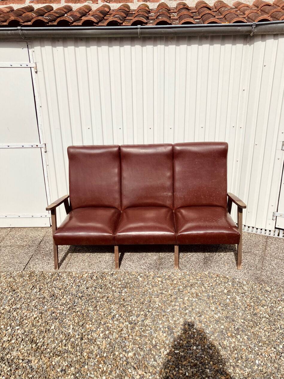 Three-seater patinated leather sofa, mid-century style.