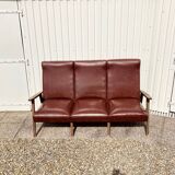 Three-seater patinated leather sofa, mid-century style.
