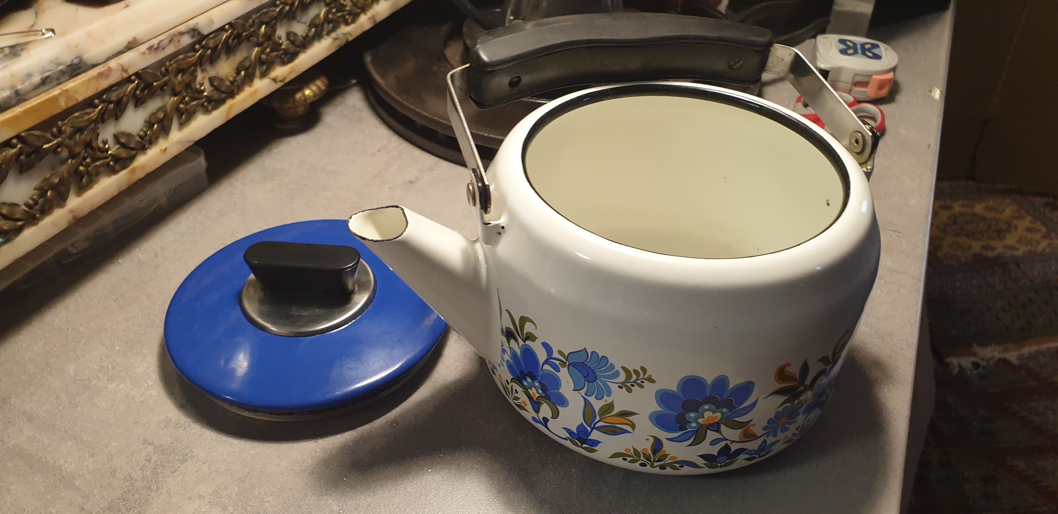 Vintage kettle in blue enamelled sheet metal