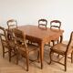 Dining table set with 6 chairs in cherry wood.