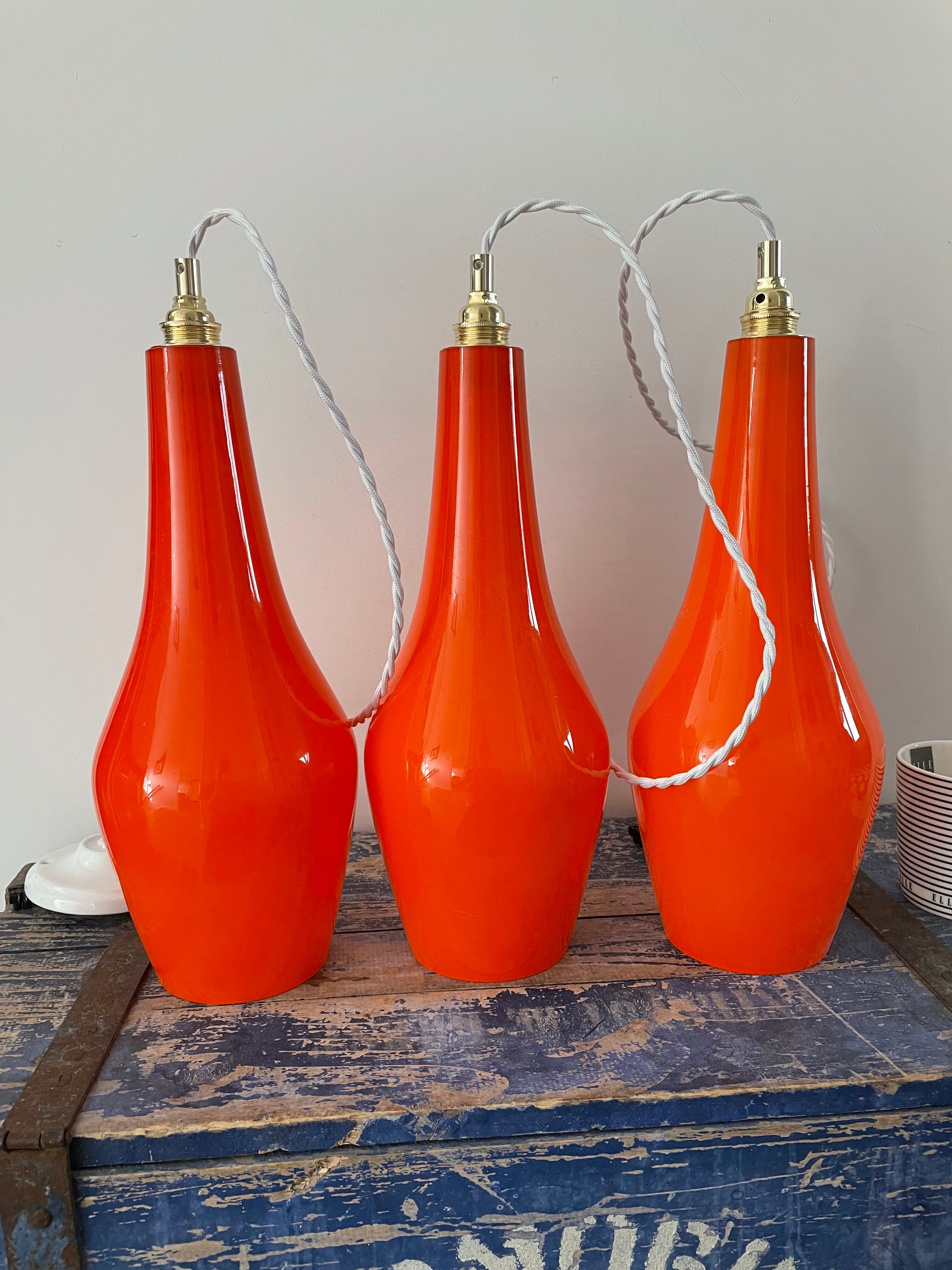 Set of three new electrified orange vintage pendant lamps
