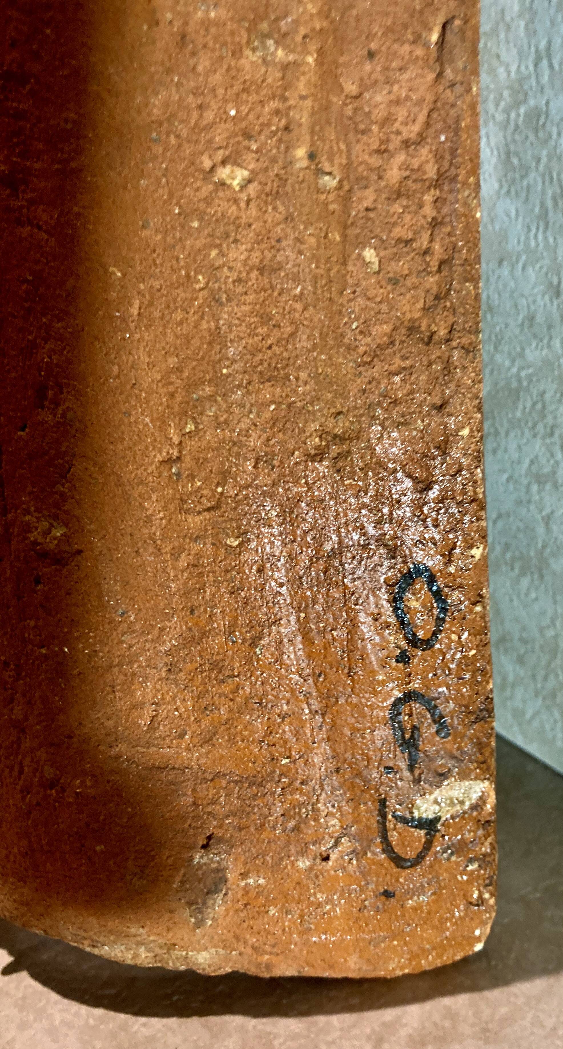 Terracotta tile with enamel decoration of a lady of the high nobility signed OGD