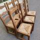 6 solid oak chairs with rush seats in a country style.