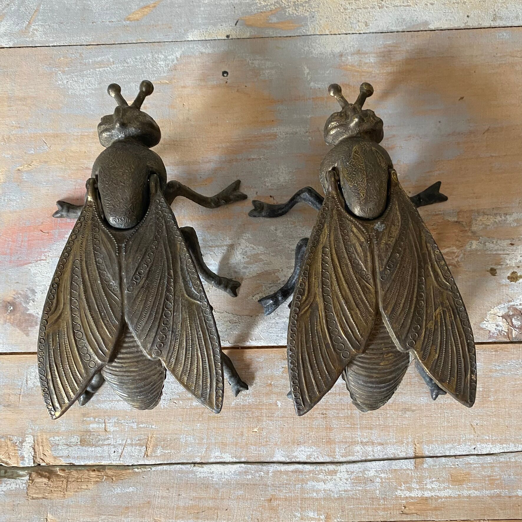 2 metal ashtrays with insect fly designs from the 1950s-60s.