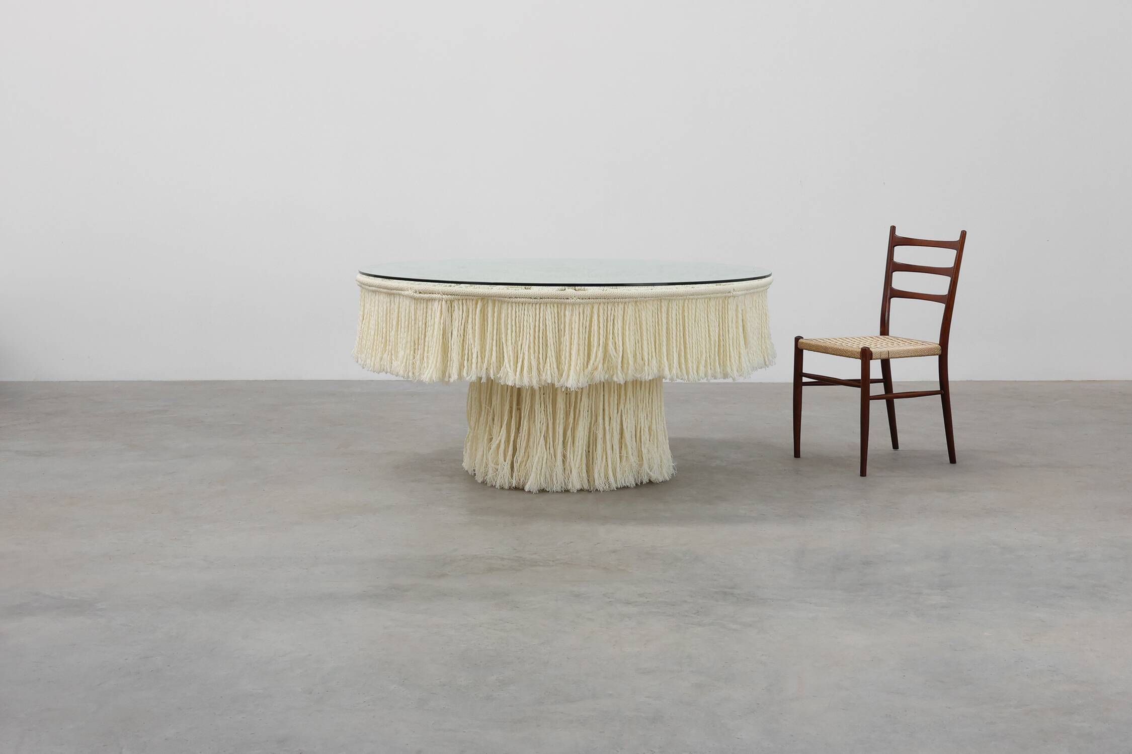 Monumental dining table with glass top and macramé, Italy