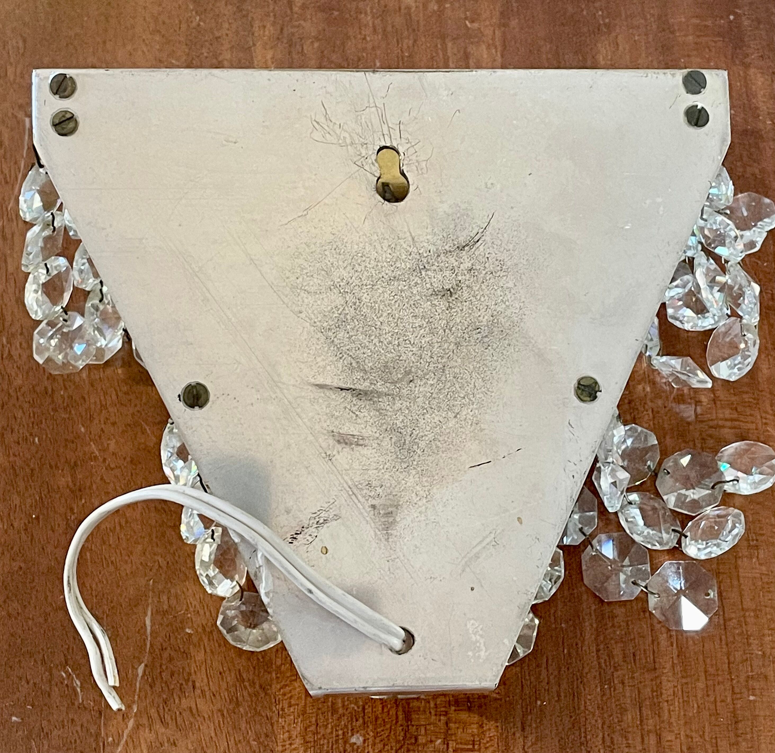 Pair of brass sconces and tassels