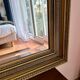 Large antique beveled mirror in the Napoleon III style - Gold and black frame