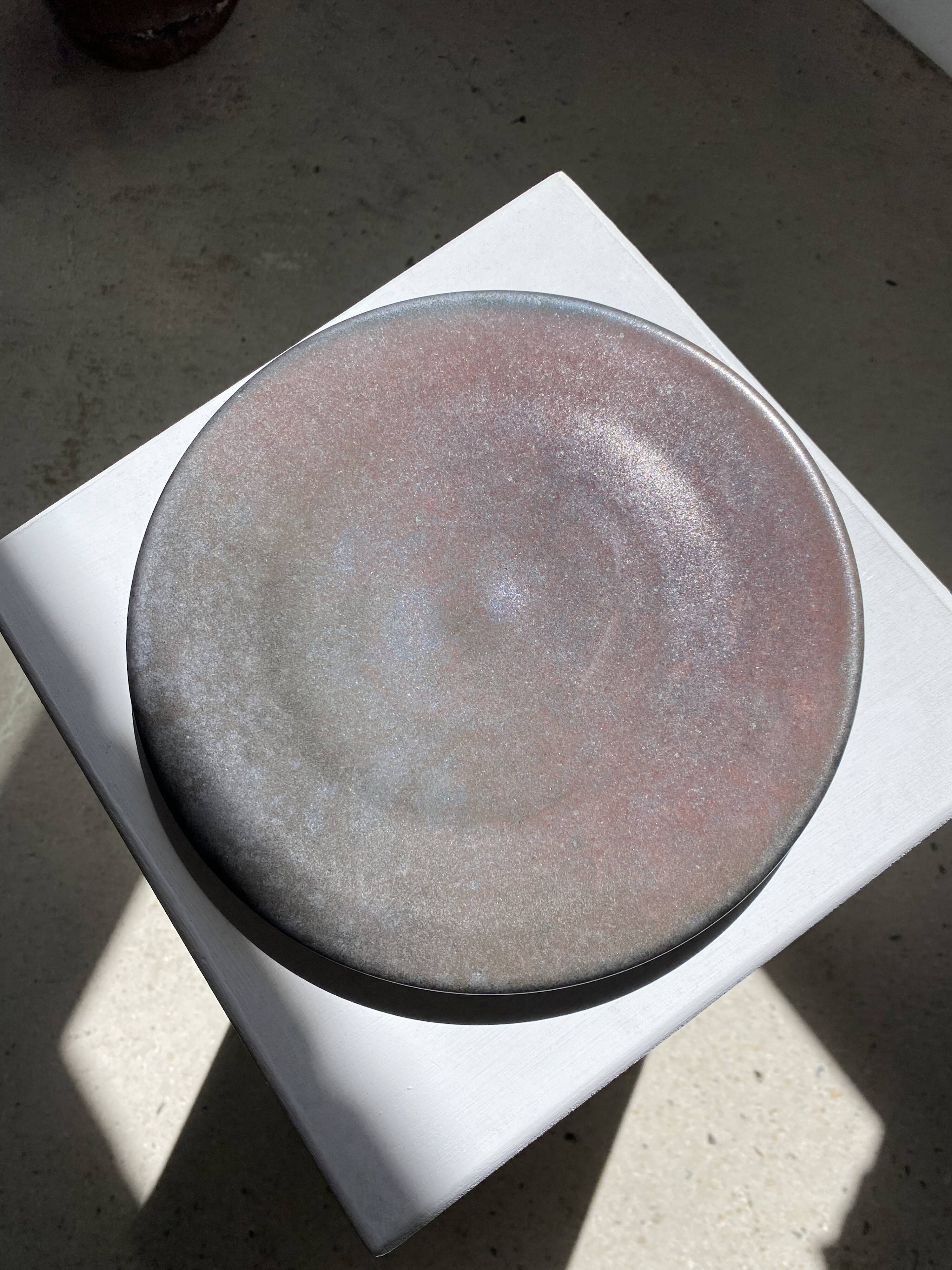 Series of 7 brown ceramic plates