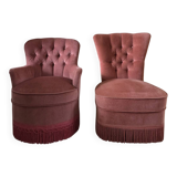 A pair of small tub chairs.