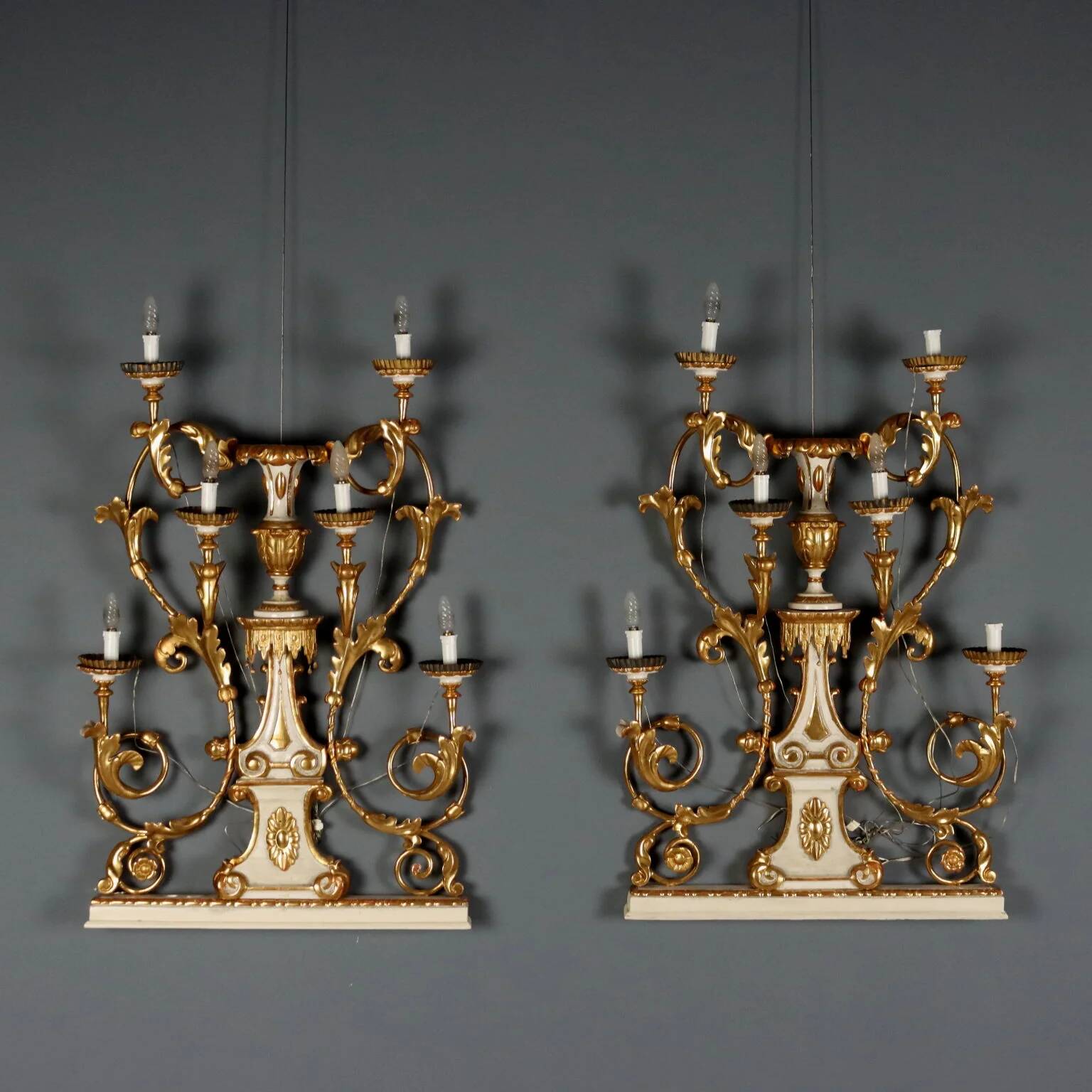 Antique wall sconces in wood and iron, Italy, mid-19th century.
