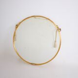 Hanging mirror in gilded brass