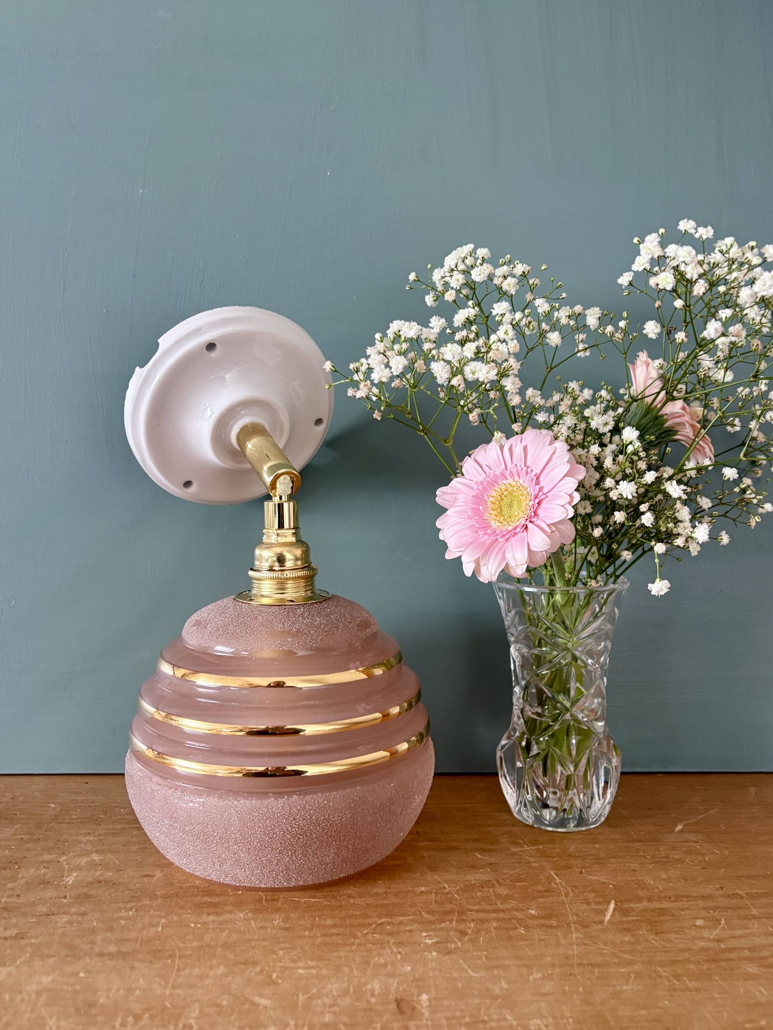 Vintage globe wall light in frosted pink and gold glass.