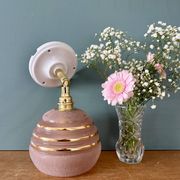 Vintage globe wall light in frosted pink and gold glass.