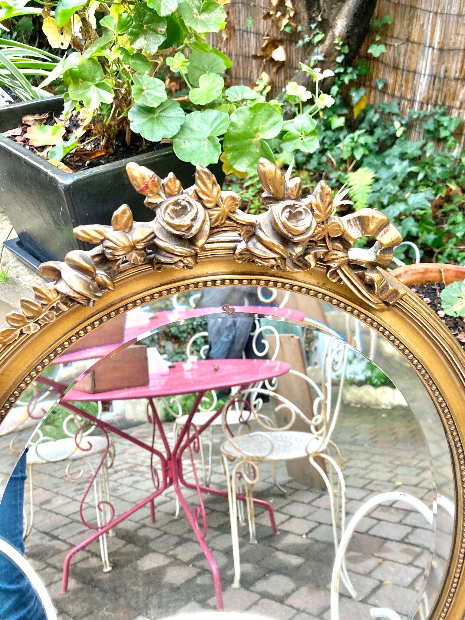 Bevelled oval mirror in vintage gilded wood 46x62cm
