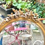 Bevelled oval mirror in vintage gilded wood 46x62cm