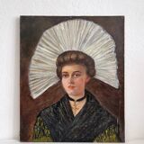 Old oil painting on canvas portrait of a woman in traditional costume