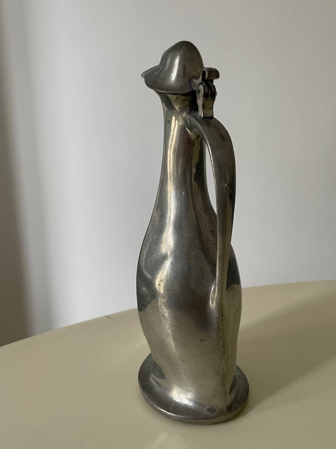 Polished pewter penguin-shaped carafe designed by Hugo Leven for Kayserzinn