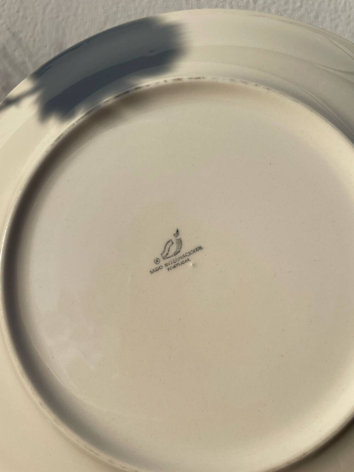 11 vintage Sado International dinner plates with plant motifs