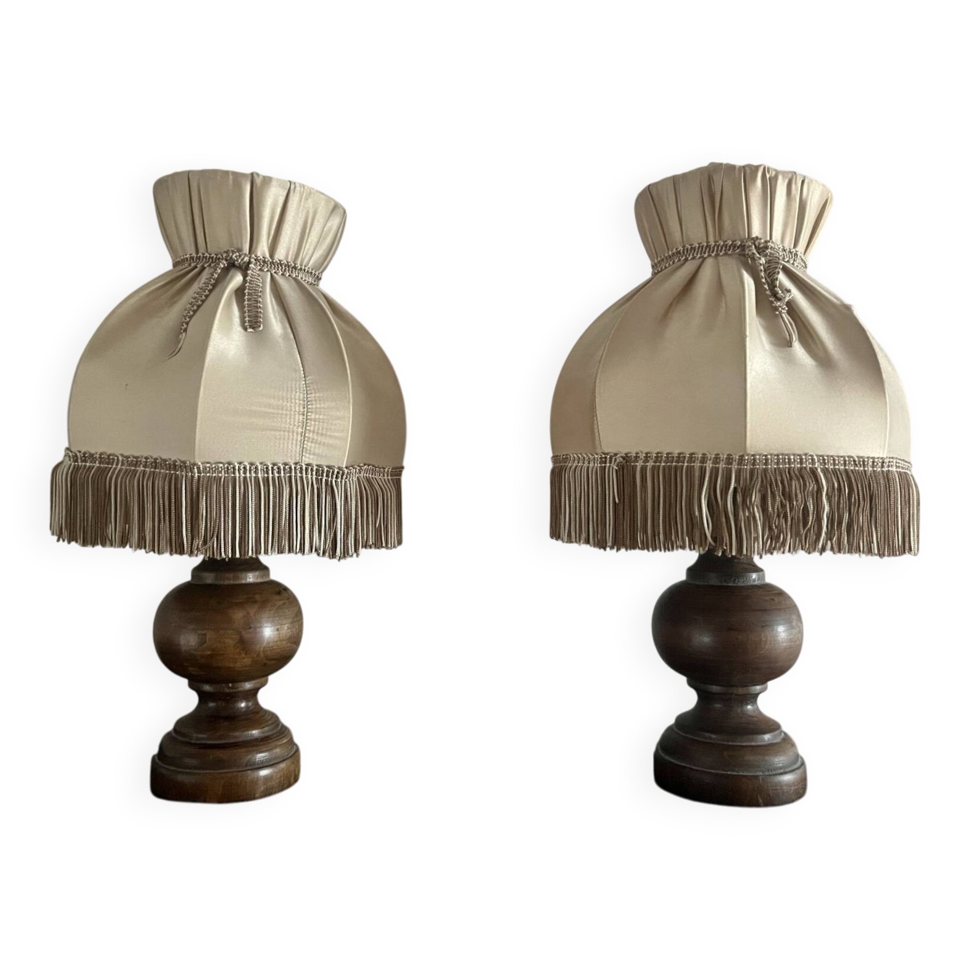 Pair of wooden bedside lamps with vintage fringe lampshades.