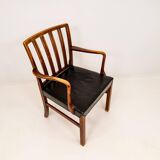 Mid-century armchair by Ole Wanscher for Fritz Hansen, stained beech and leather.