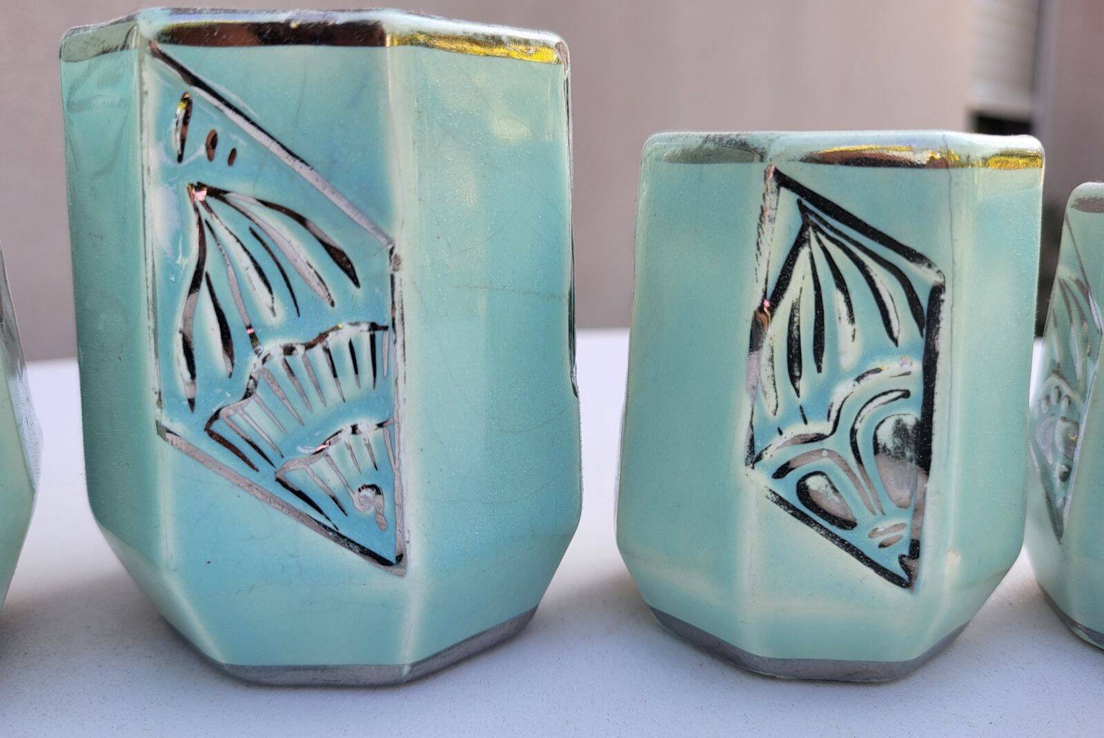 Set of 4 Art Deco celadon green and silver barbotine pots.