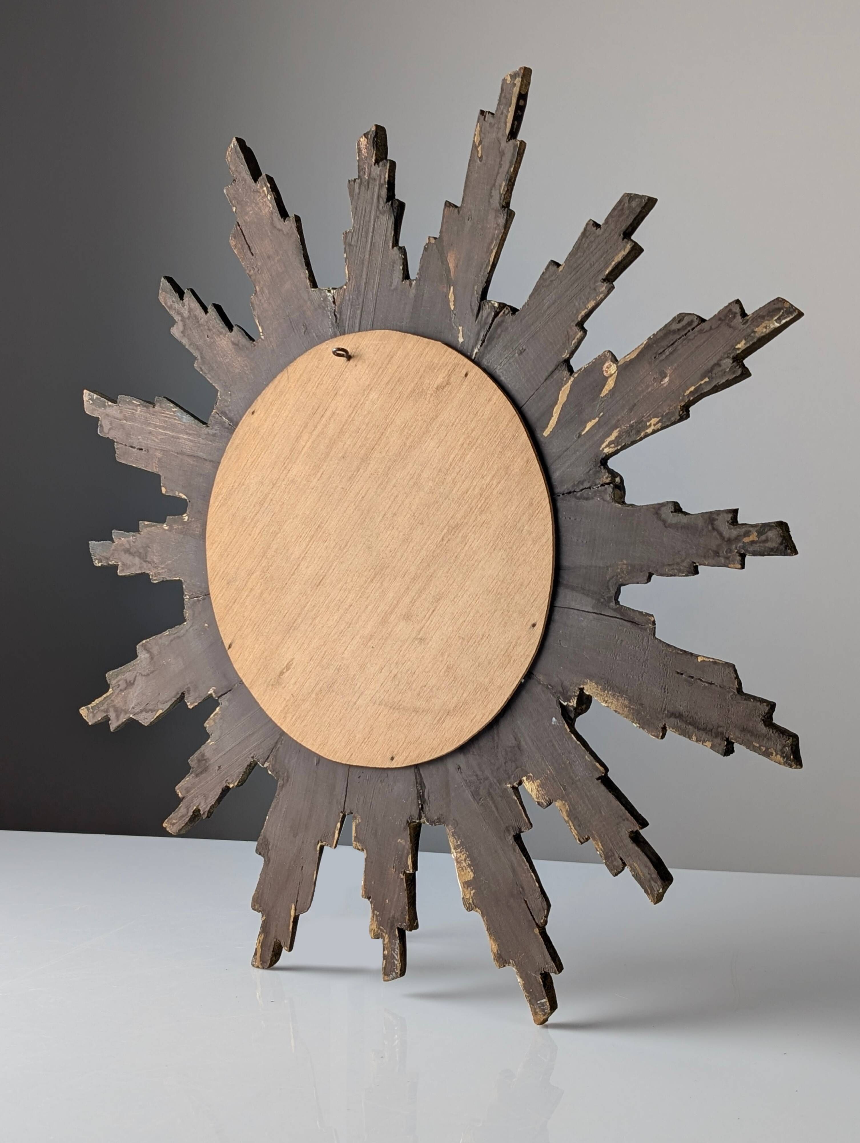 Convex sunburst mirror in carved and gilded wood, 1950s