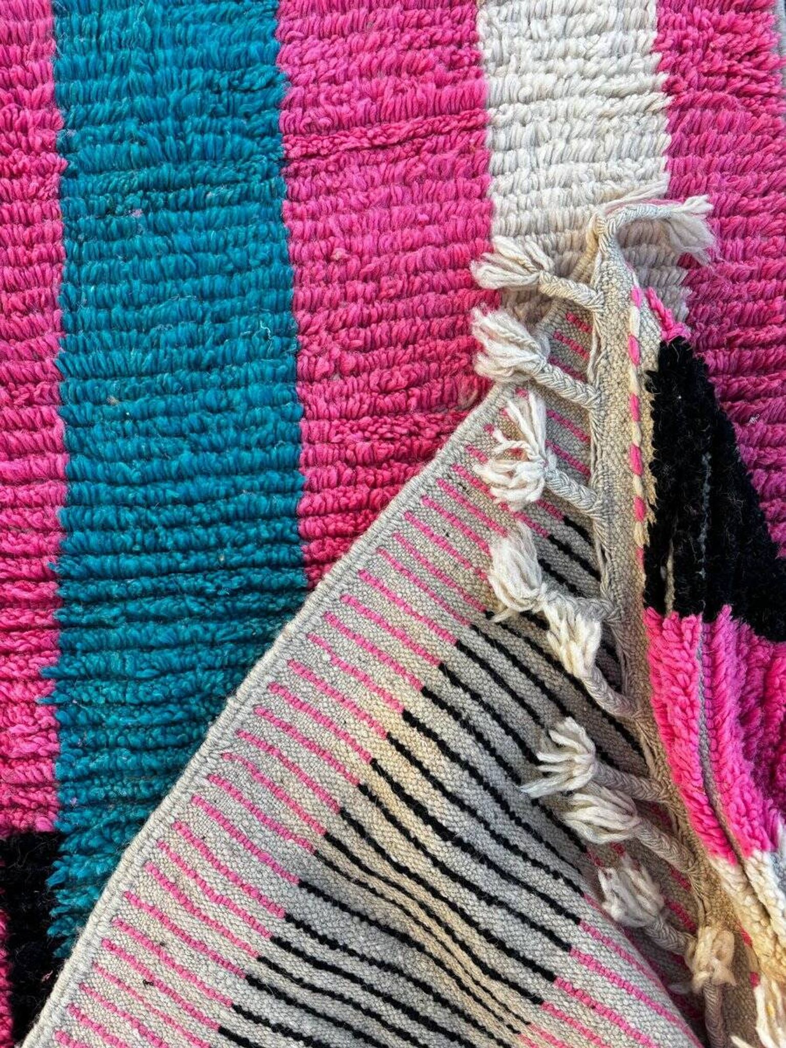 Moroccan Berber rug corridor in pink and blue wool.