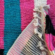 Moroccan Berber rug corridor in pink and blue wool.