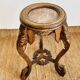 Carved wooden stool, red marble top, early 20th century