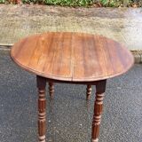 Louis Philippe round table with leaves, solid wood, 19th century, 95cm.