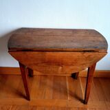 Antique round walnut table with flaps