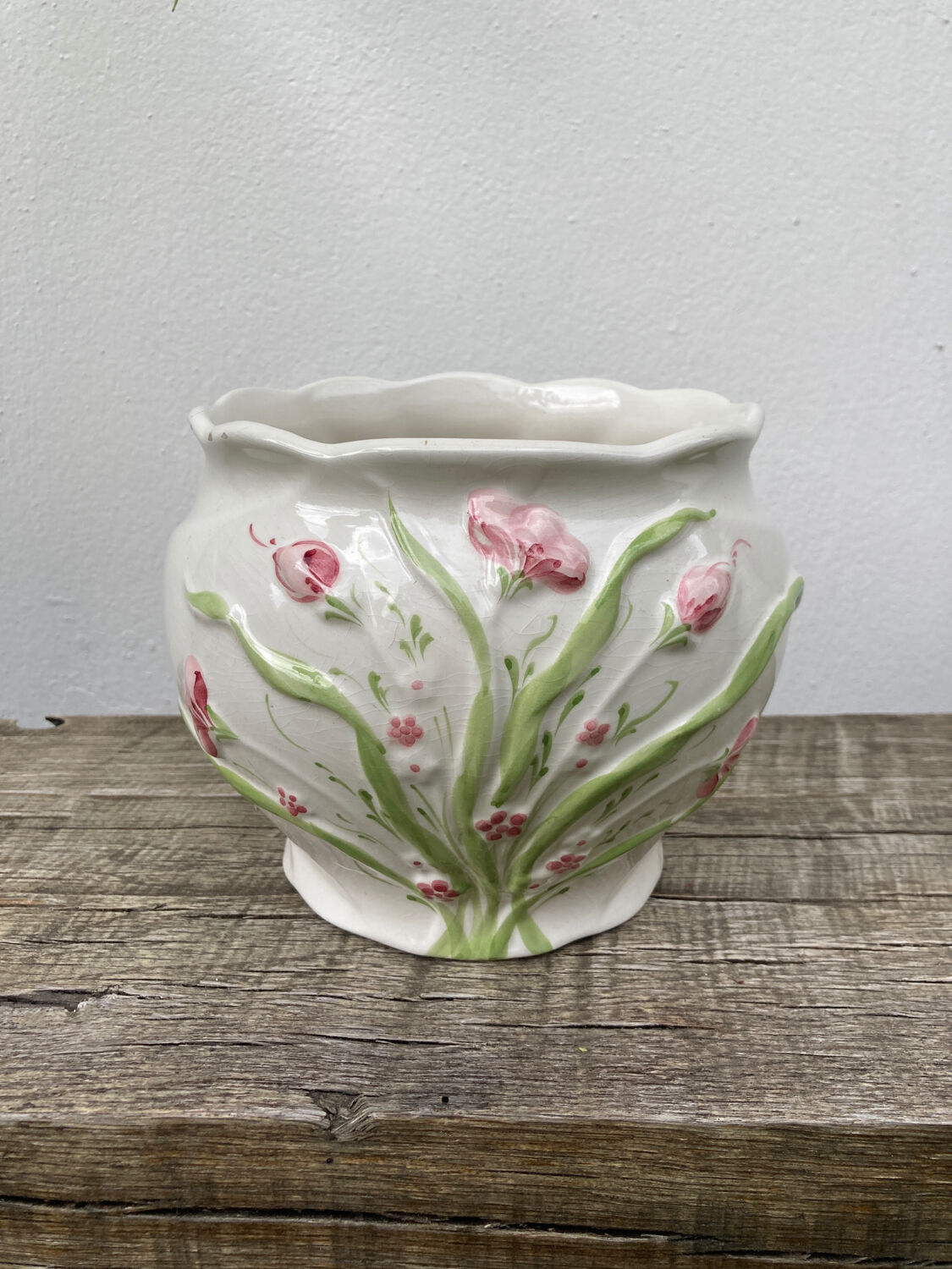 White ceramic pot cache in old flower slip