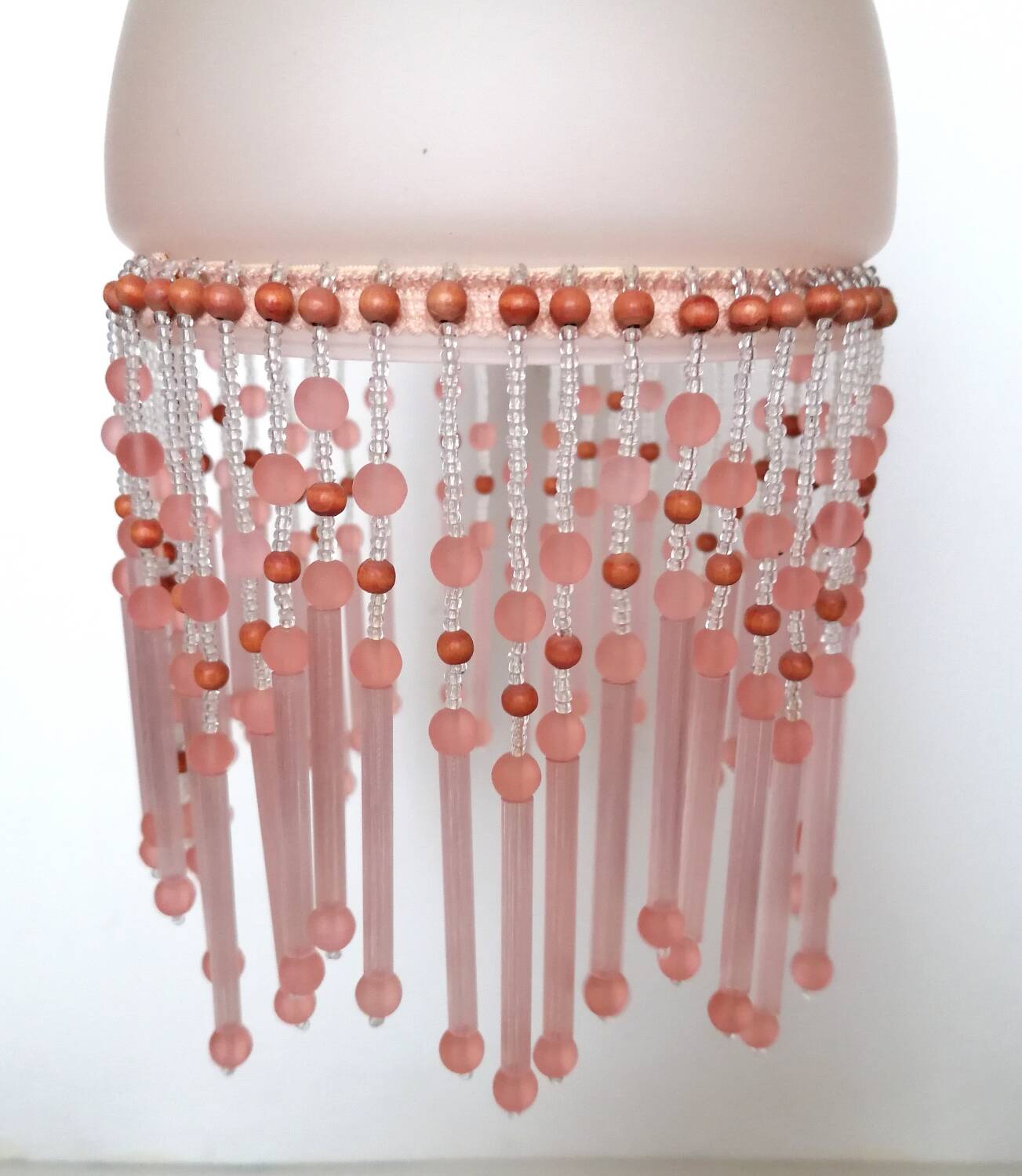 Pink glass wall lamp with garland of pearls