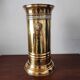 Vintage brass umbrella stand with lion decoration.