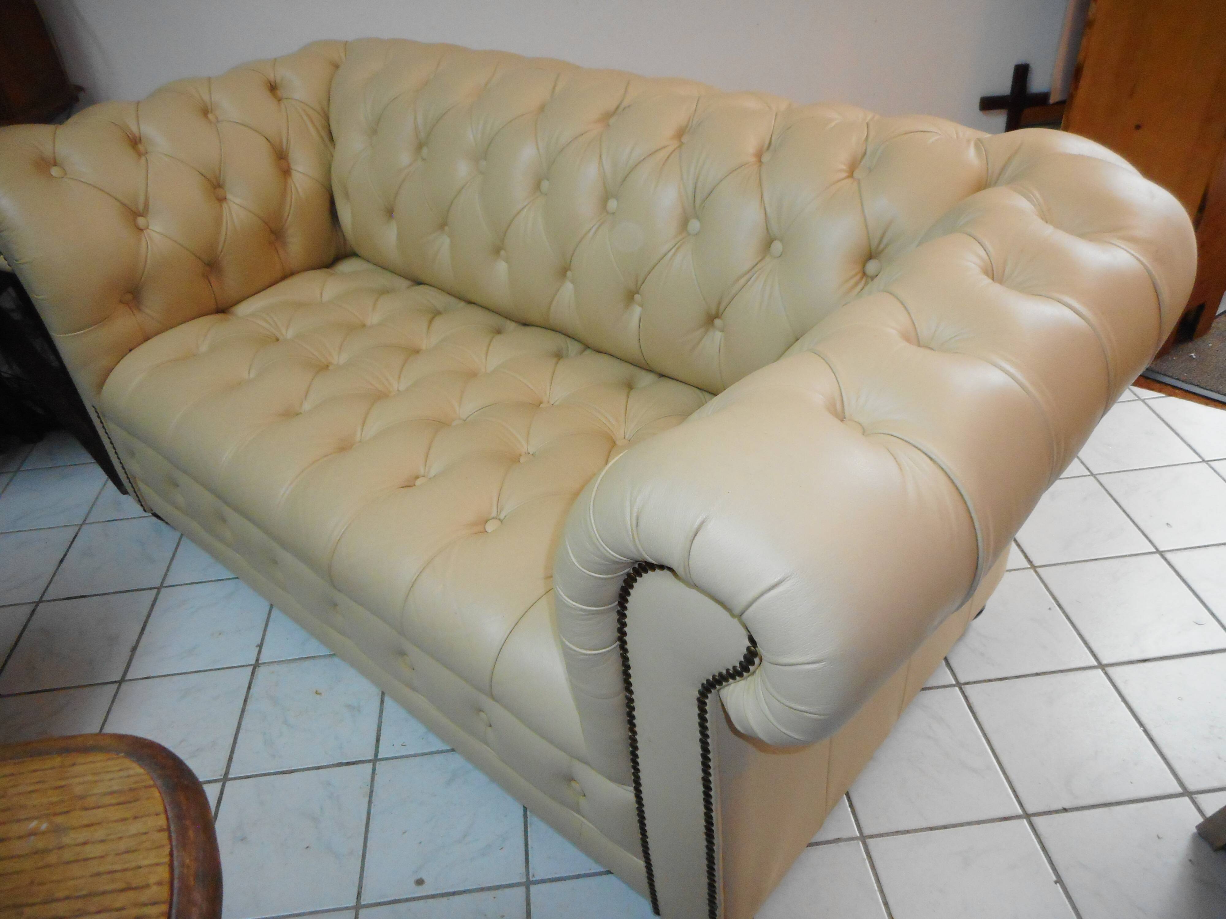 Beige leather chesterfield sofa