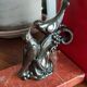 Zinc art bookends in the shape of birds on red marble - warblers