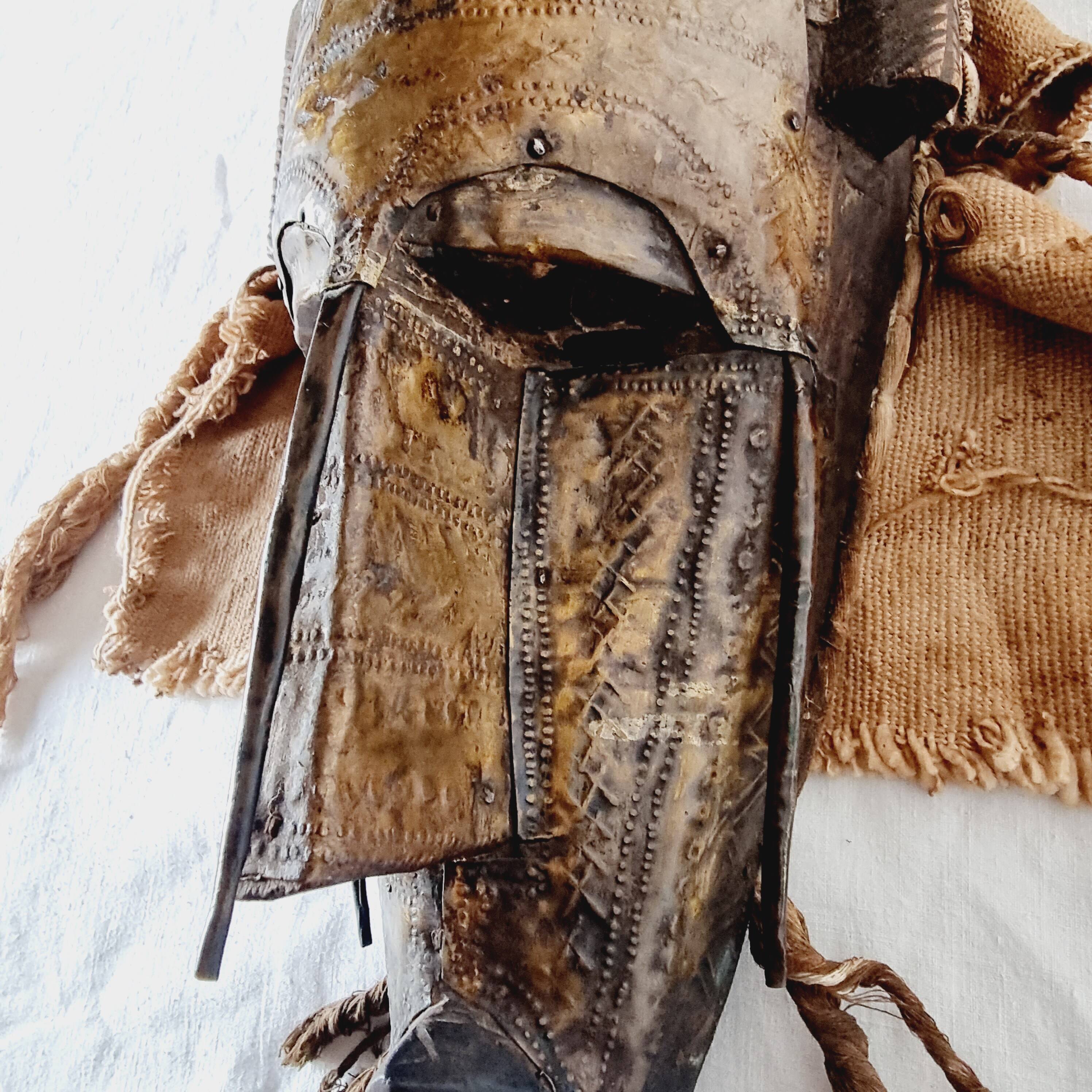 African mask from Mali from the N'Tomo tribe of Marka covered in chiseled brass